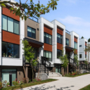 Street-level photograph of Avenue 33 by Vertex Developments showing the modern townhome building exterior on Vancouver’s West Side.